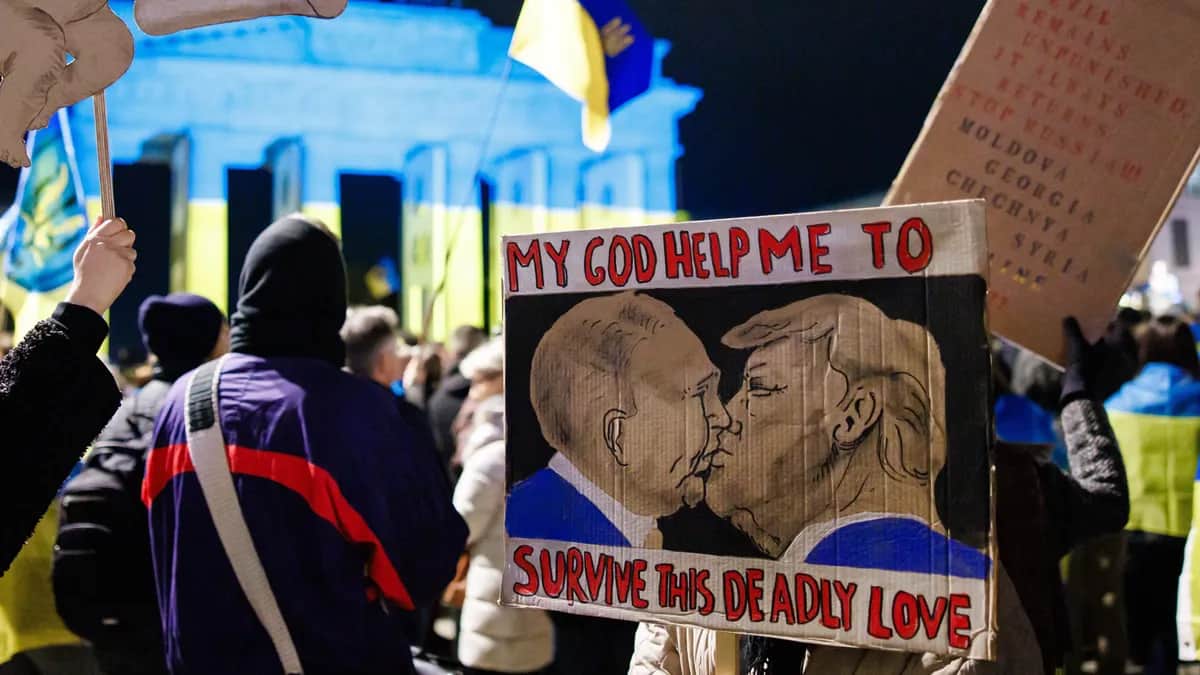 A demonstrator holds a placard at a rally on the third anniversary of the Russian invasion of Ukraine in Berlin, 24 February 2025. EPA-EFE/CLEMENS BILAN