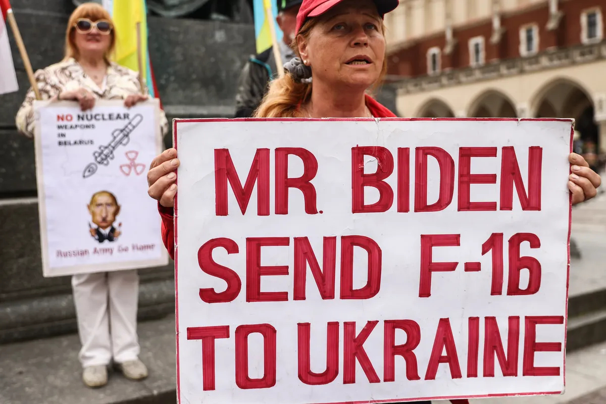 A woman holding a poster demanding to provide Ukraine with F-16 fighters, Kraków, Poland, 16 May 2023. Photo: Beata Zawrzel / NurPhoto / Getty Images 