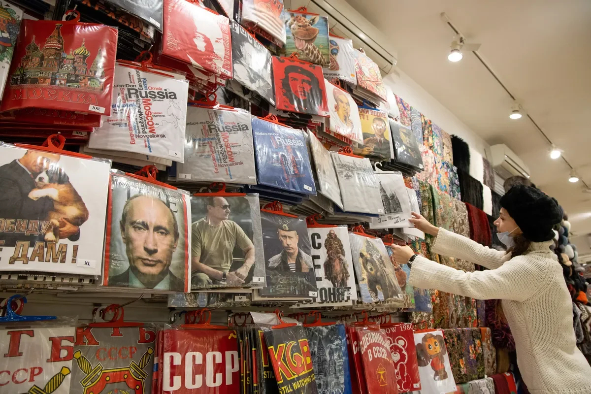 A souvenir shop selling T-shirts with pictures of Vladimir Putin. Moscow, Russia. Photo: Andrey Rudakov/Getty Images