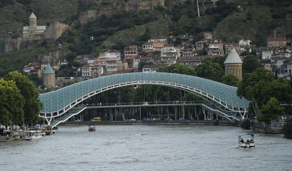The Bridge of Peace with Tbilisi’s old town behind it, 3 June 2024. Photo: EPA-EFE/DAVID MDZINARISHVILI