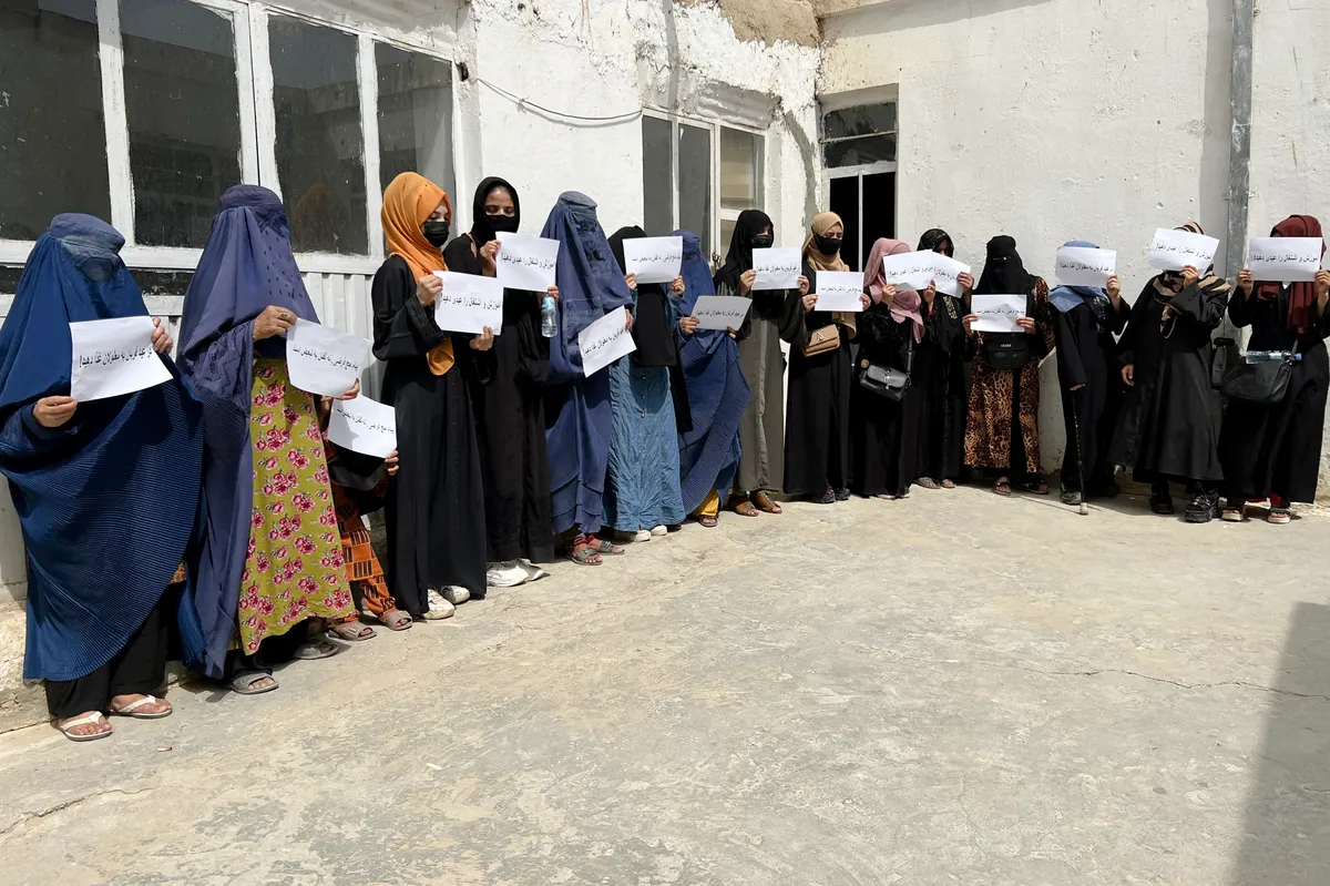 Afghan women hold up signs demanding their rights to education and employment. Mazar-e-Sharif, Afghanistan, 26 June 2023. Photo by EPA-EFE
