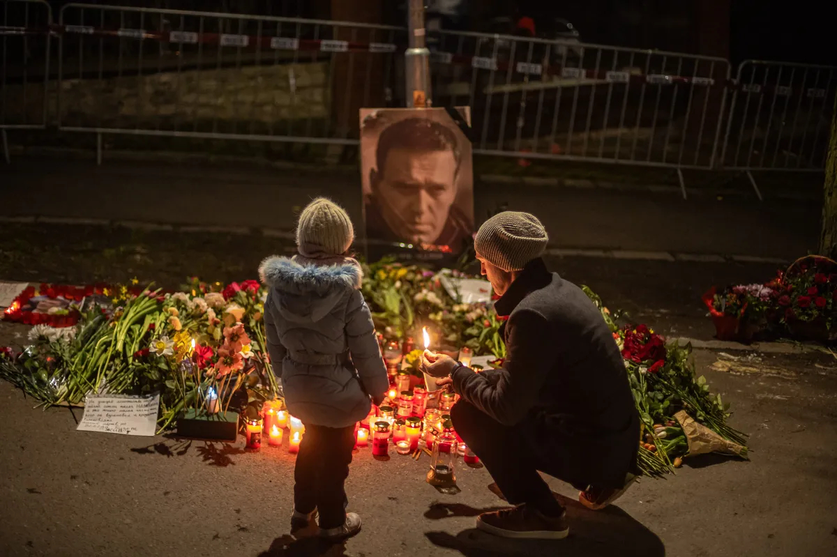 People pay tribute to Alexey Navalny at a makeshift memorial in front of the Russian embassy in Prague, Czechia, 1 March 2024. Photo: EPA-EFE / MARTIN DIVISEK