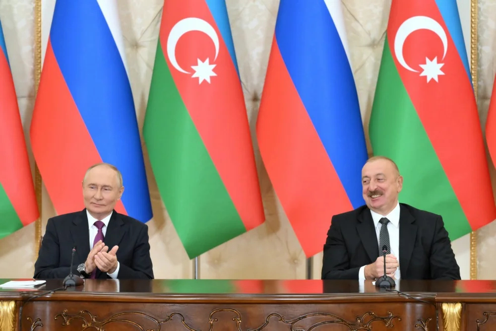 Vladimir Putin and Azerbaijani President Ilham Aliyev attend a signing ceremony following a meeting outside Baku, Azerbaijan, 19 August 2024. Photo: EPA-EFE/GRIGORY SYSOEV / SPUTNIK / KREMLIN POOL 