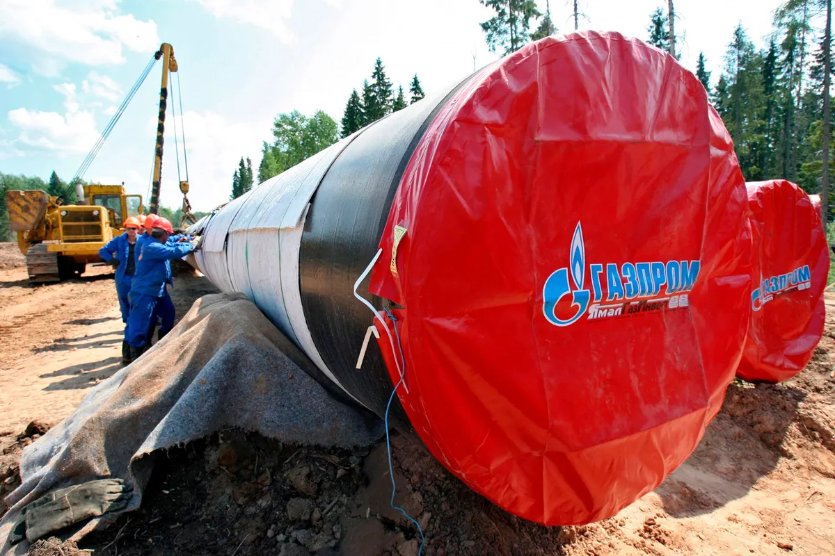 Gazprom workers laying a gas pipeline near St. Petersburg, Russia. Photo: EPA/ANATOLY MALTSEV