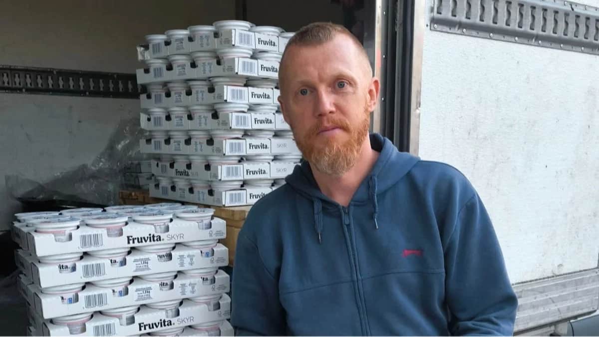 Siarhei Melianets with multiple cartons of skyr donated to his food bank. Photo: Siarhei Melianets