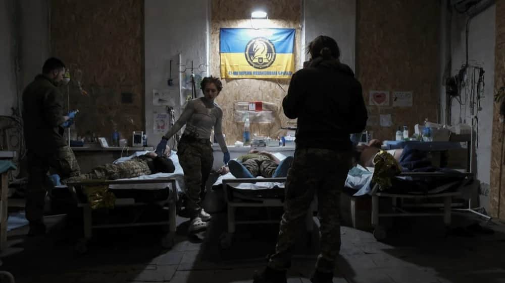 Military medics treat an injured Ukrainian soldier at a frontline field hospital, at an undisclosed location in the Donetsk region of eastern Ukraine, 25 February 2024.&nbsp;Photo:&nbsp;EPA-EFE/VITALII NOSACH