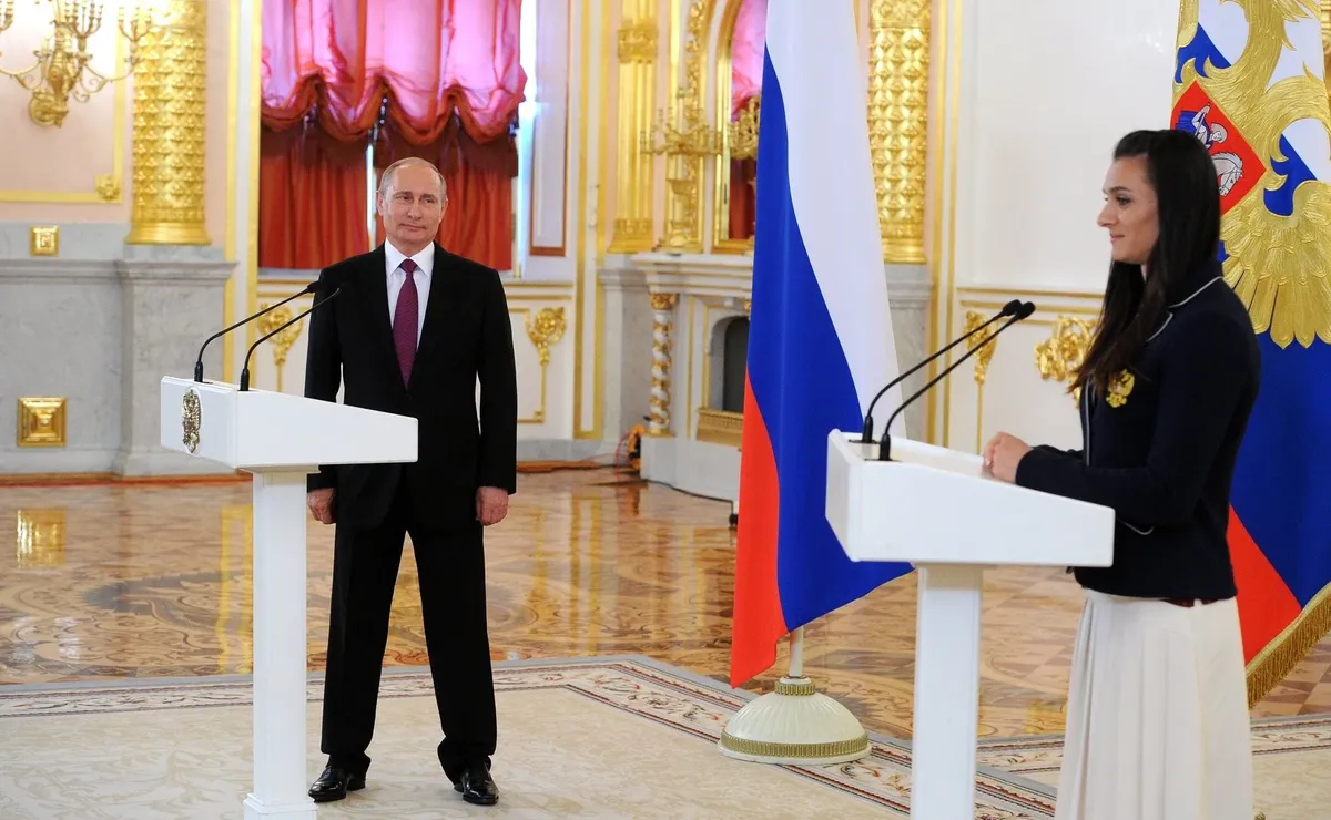 Vladimir Putin and Elena Isinbayeva. Photo by <a href="http://www.kremlin.ru/events/president/news/20331/photos/18909" rel="noopener noreferrer" title="http://www.kremlin.ru/events/president/news/20331/photos/18909">the Kremlin</a>