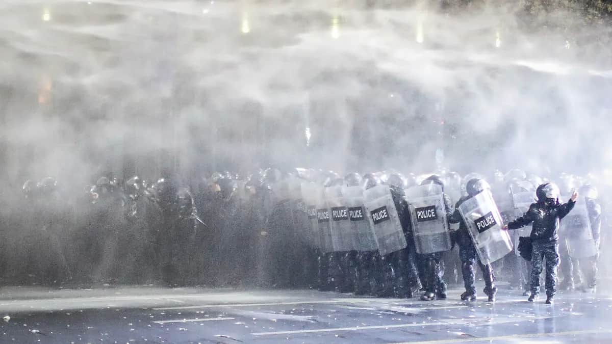 Police use water cannons and tear gas to disperse protesters in front of the parliament building in Tbilisi, Georgia, 29 November 2024. Photo: EPA / David Mdzinarishvili<br>