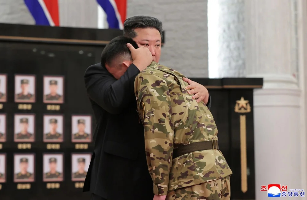 Kim Jong Un comforts a North Korean soldier in a ceremony honouring soldiers serving in overseas operations held in Pyongyang, North Korea. Photo: EPA/KCNA