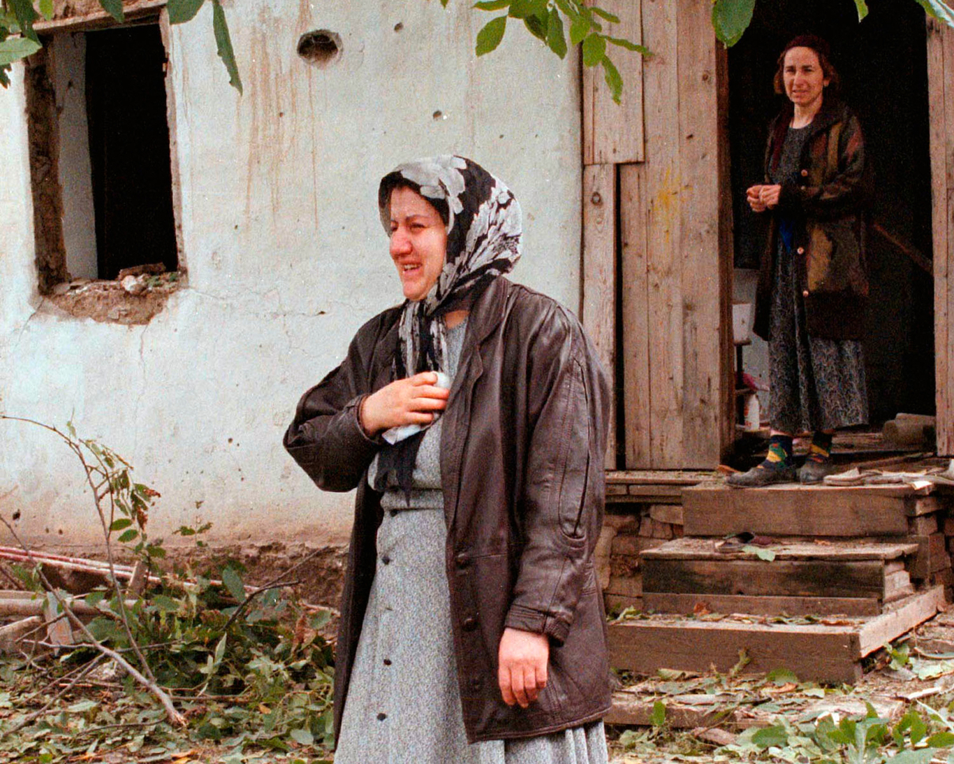 Chechen women outside their home after it was damaged in an airstrike. Staraya Sunzha, Chechnya, 28 September 1999. Photo: Reuters / Scanpix / LETA