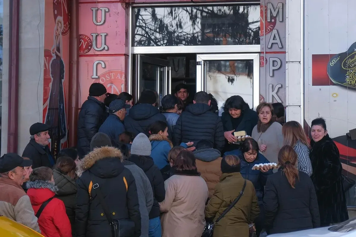 People queueing up for food handed out under the ticket system. Photo: Ani Balayan