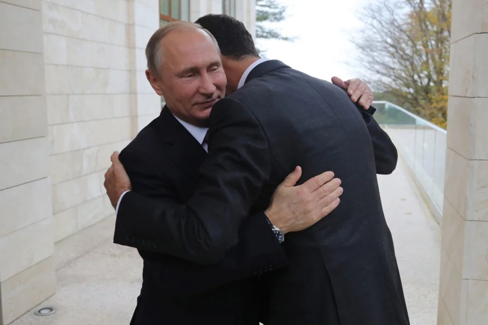 Vladimir Putin welcomes Bashar al-Assad during their meeting in the Black sea resort of Sochi, Russia, 20 November 2017. Photo: EPA-EFE/MICHAEL KLIMENTYEV/SPUTNIK/KREMLIN / POOL 