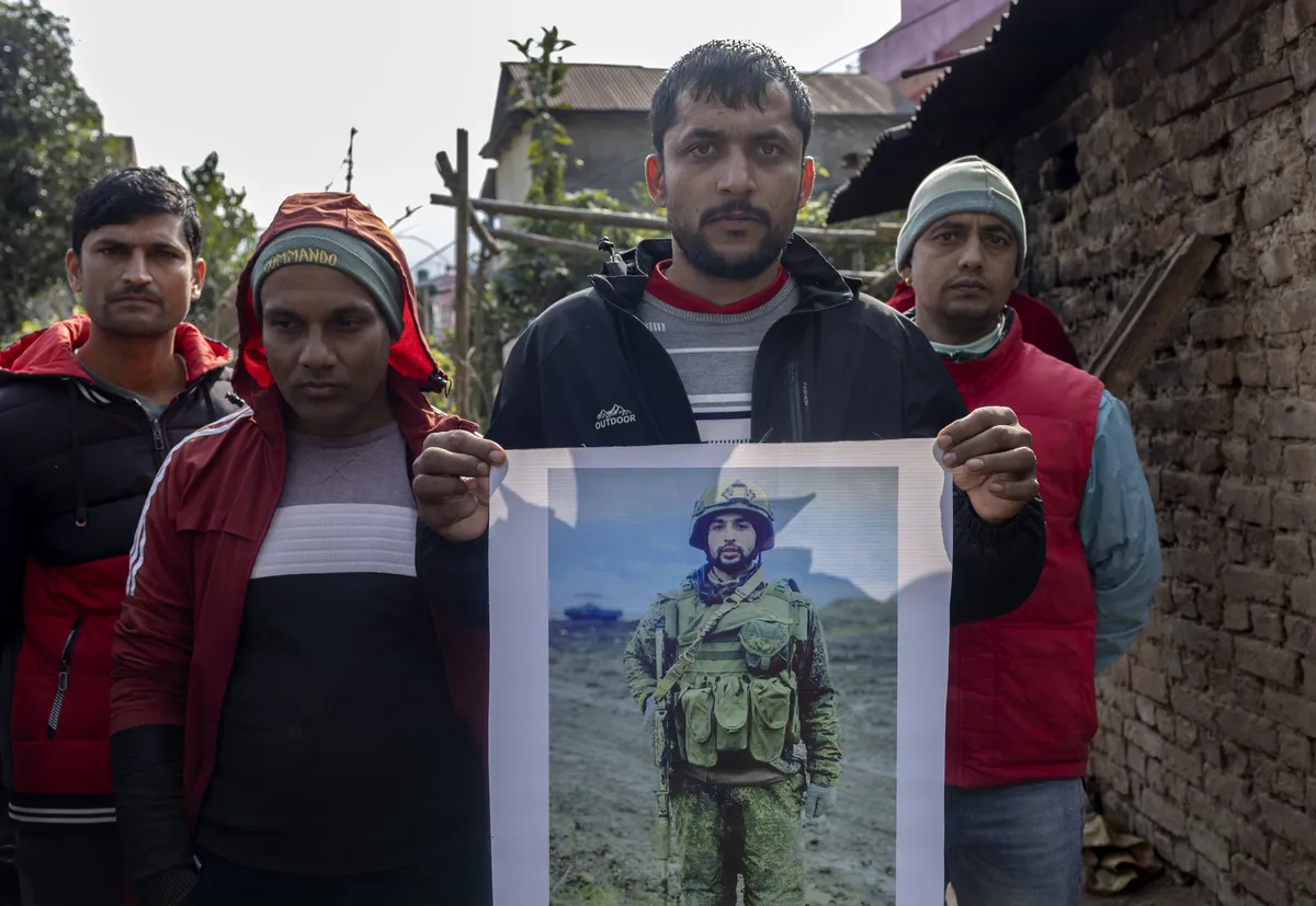 A group of Nepalis attend the final rites of a friend who died fighting for the Russian military in Ukraine, Walling, Syangja district, Nepal, 19 January 2024. Photo: EPA-EFE / NARENDRA SHRESTHA