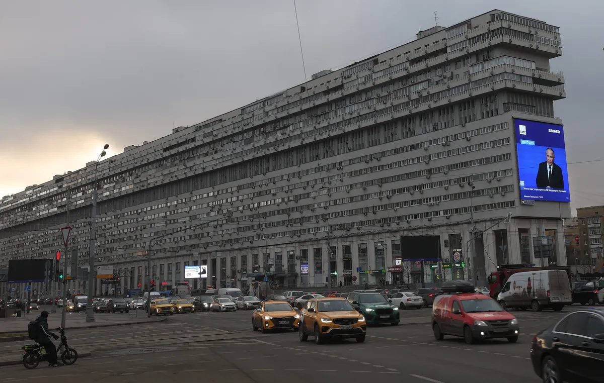 A giant screen displays a live broadcast of the Russian President Vladimir Putin's annual press conference, in Moscow, Russia, 19 December 2025. Photo: EPA / Maxim Shipenkov
