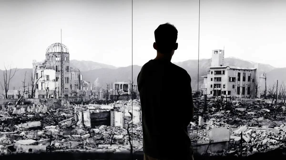 A visitor looks at a picture of devastation caused by the world’s first atomic bombing at the Hiroshima Peace Memorial Museum, Japan, 5 August 2025. Photo: EPA / FRANCK ROBICHON