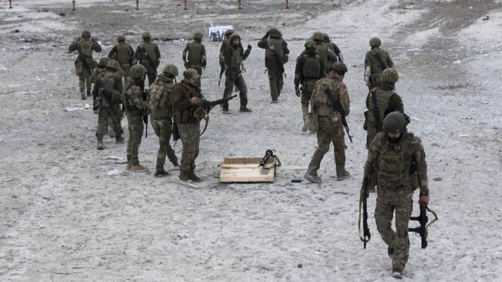 Ukrainian servicemen attend training on a shooting range in eastern Ukraine in March. Photo: EPA-EFE/YAKIV LIASHENKO