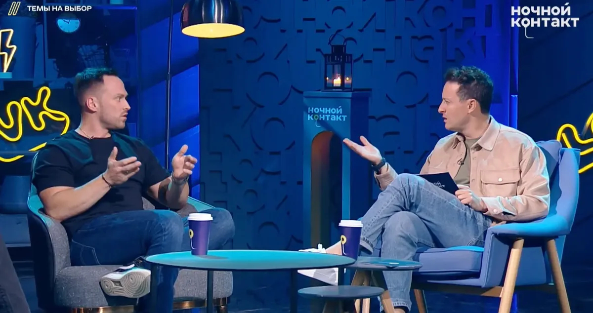 Alexey Stolyarov (left) during an interview. A screenshot from a video