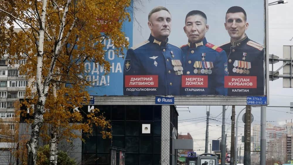 A billboard showing portraits of Russian officers reads ‘There are many peoples-One Homeland’ in St. Petersburg, Russia, 08 November 2023. Photo: EPA-EFE/ANATOLY MALTSEV