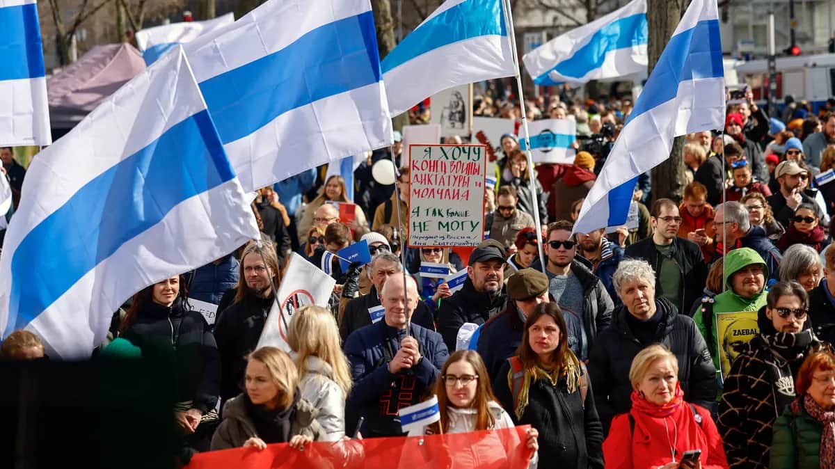 People attend a protest against the Putin regime in front of the Russian embassy in Berlin on the last day of the presidential election on Sunday. Photo: EPA-EFE/HANNIBAL HANSCHKE