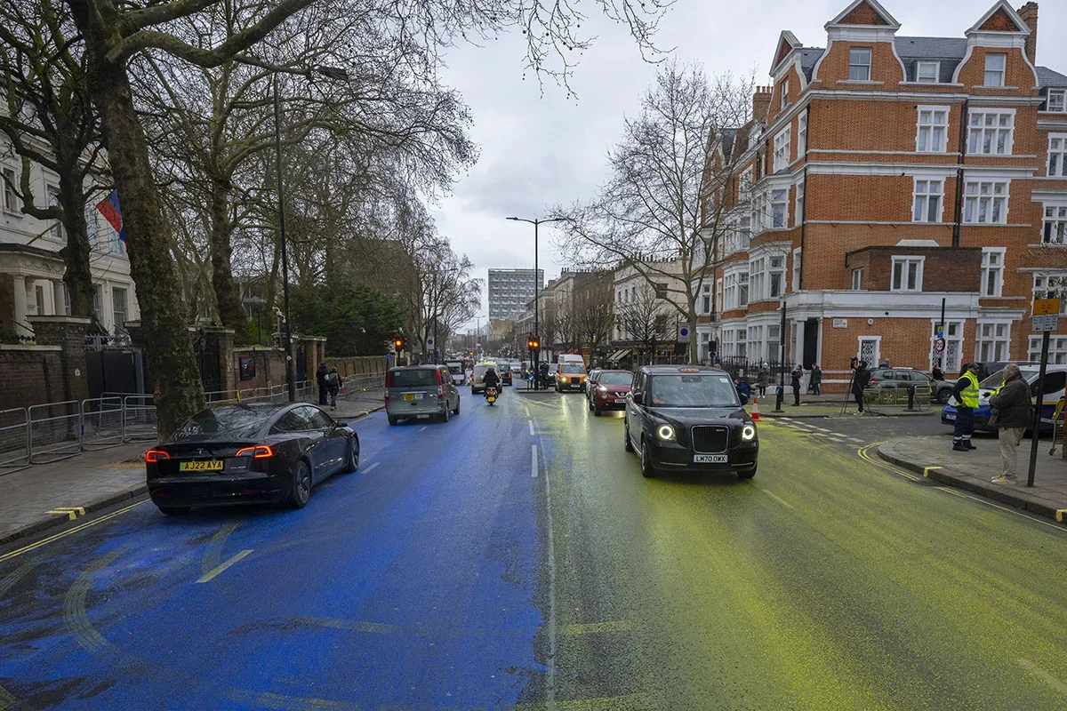The Ukrainian flag, painted by a group of activists on the street in front of the Russian embassy, London, 23 February 2023. Photo: Rasid Necati Aslim / Anadolu Agency / Getty Images
