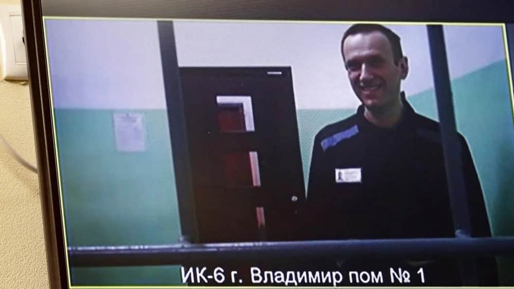 Alexey Navalny &nbsp;seen on a screen as he appears in a video link from prison in September 2023. Photo: EPA-EFE/MAXIM SHIPENKOV