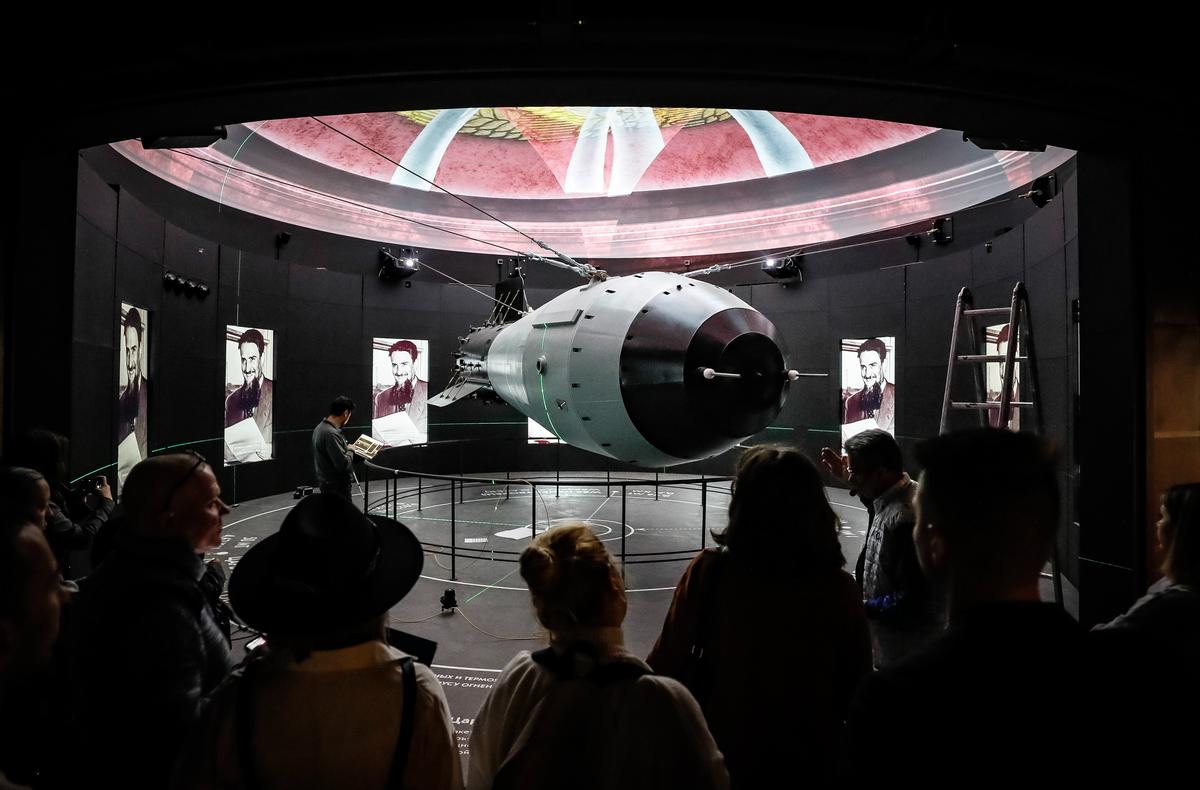 Visitors look at a scale model of the Tsar Bomba, the most powerful nuclear weapon ever created and tested, at the All-Russian Exhibition Centre in Moscow, 26 October 2023. Photo: EPA / Yuri Kochetkov
